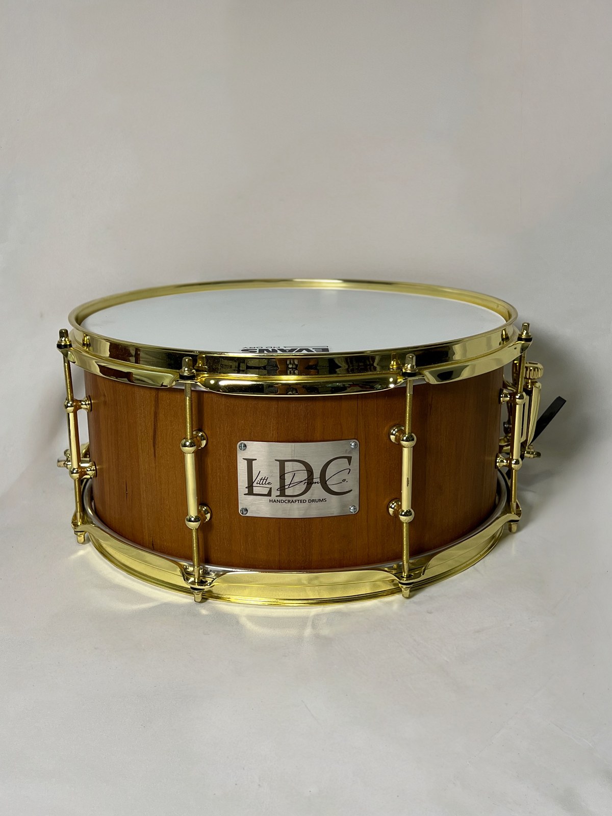 Cherry stave snare drum with brass hardware, handcrafted by Little Drum Co.