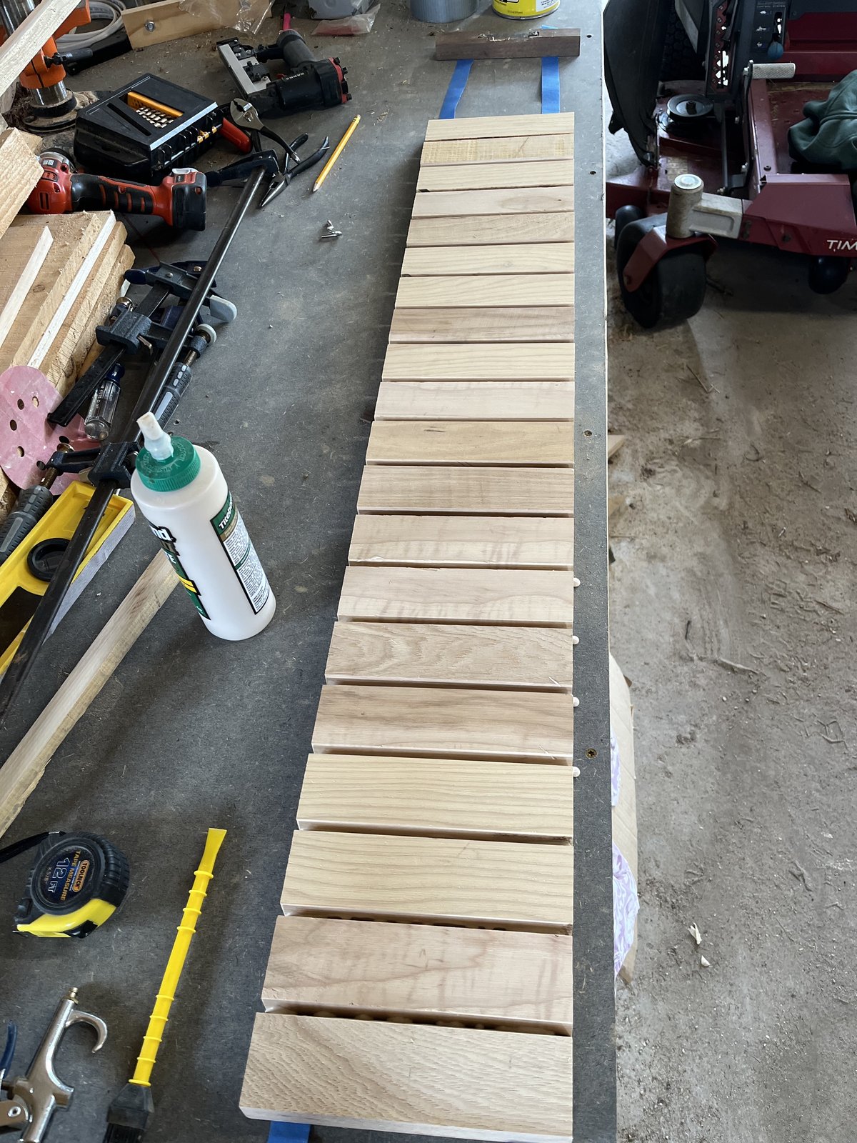 Cut staves laid out in sequence on the bench, ready for glue-up